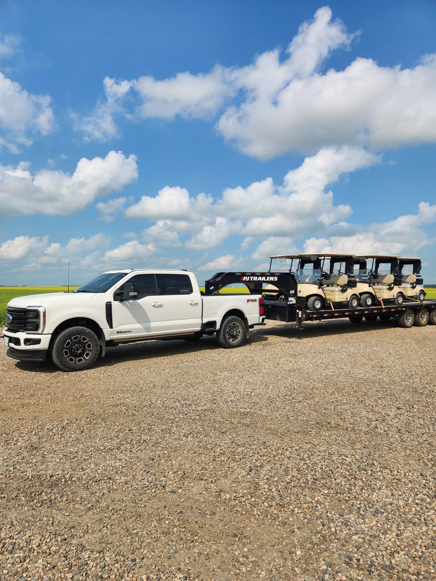 Road Fiftynine truck hauling a trailer of new Yamaha golf carts