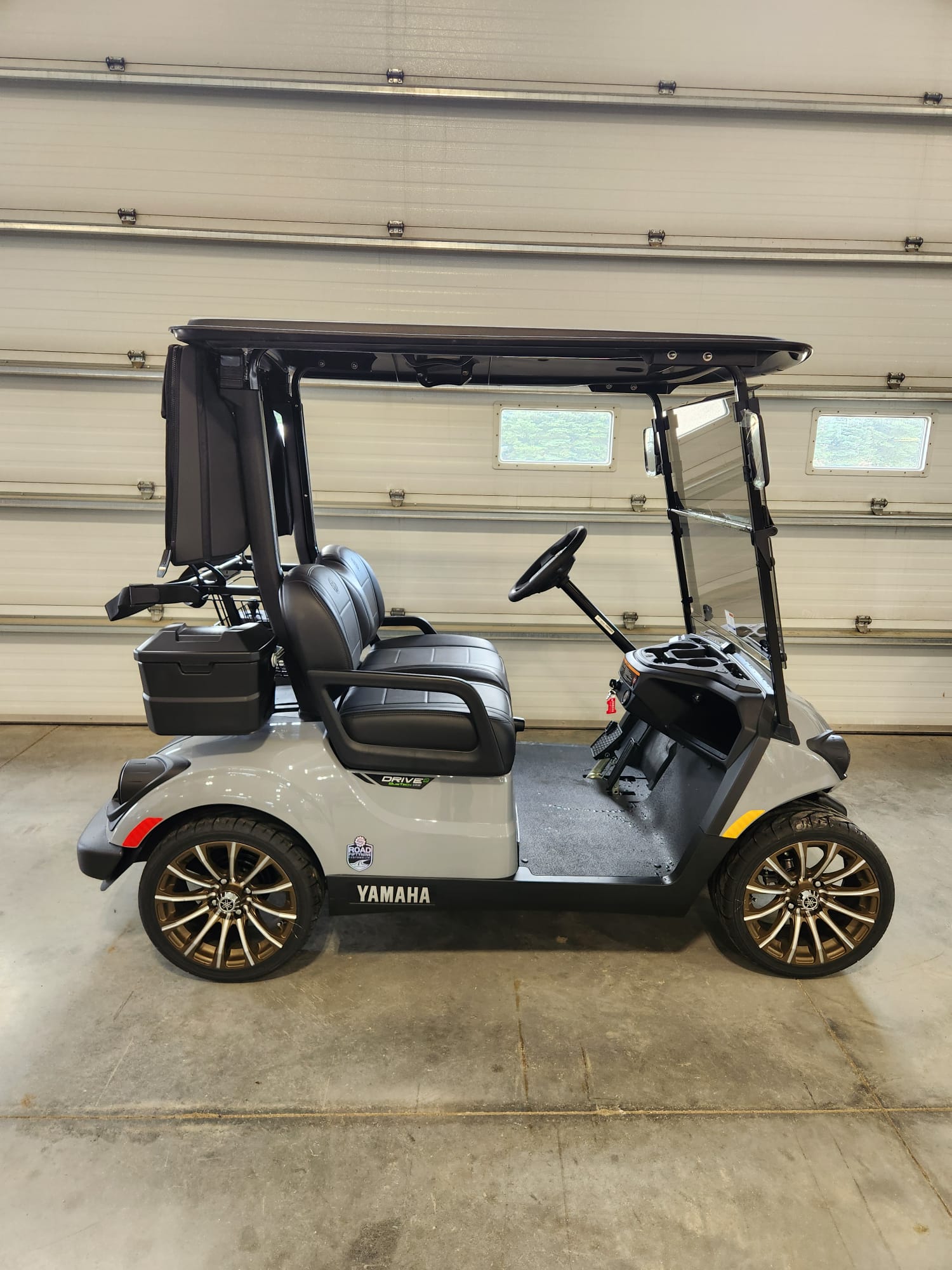 Grey Yamaha Drive2 with black seats and bronze wheels