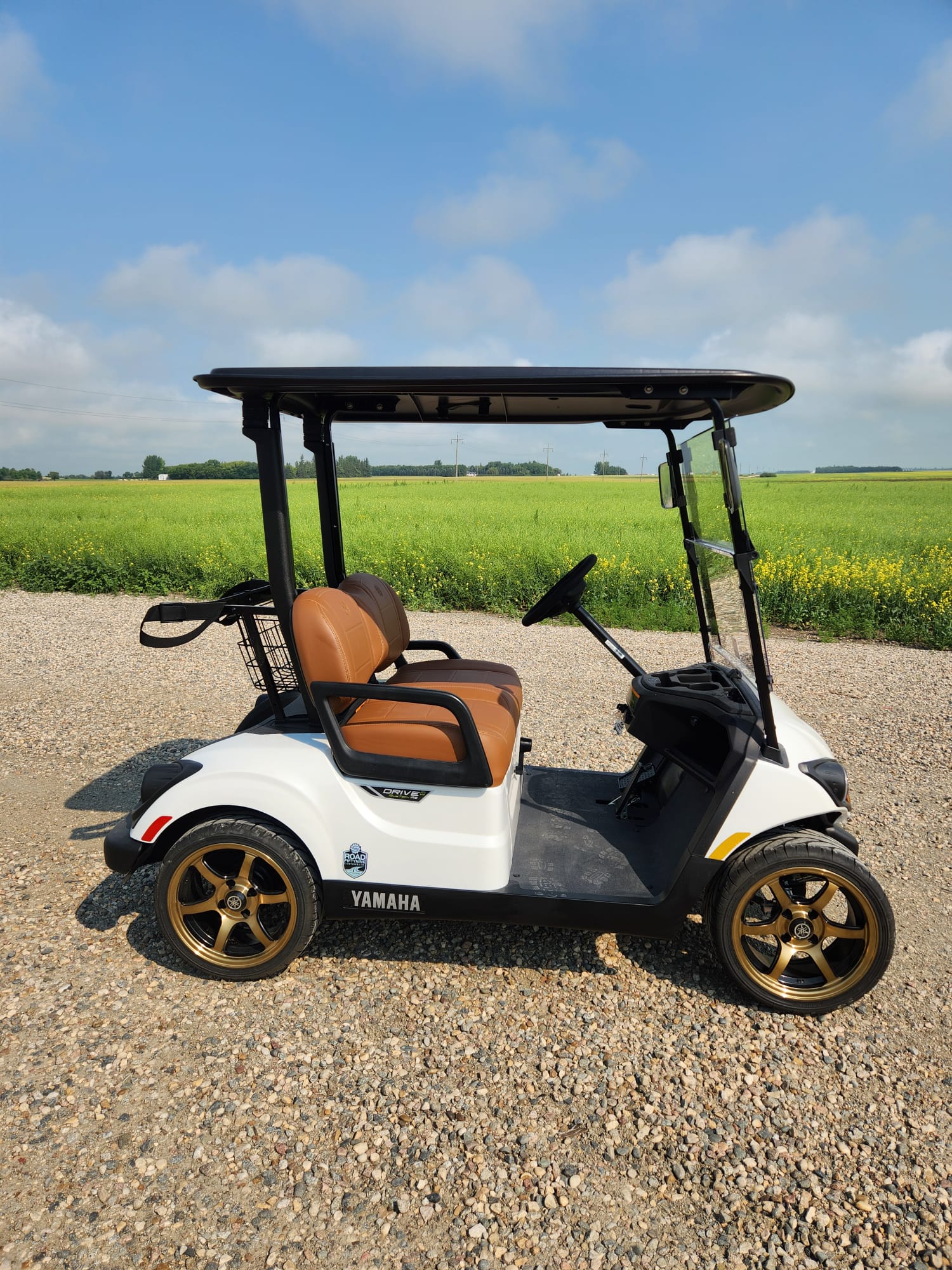 White 2026 Yamaha Drive2 with tan leather seats and bronze wheels