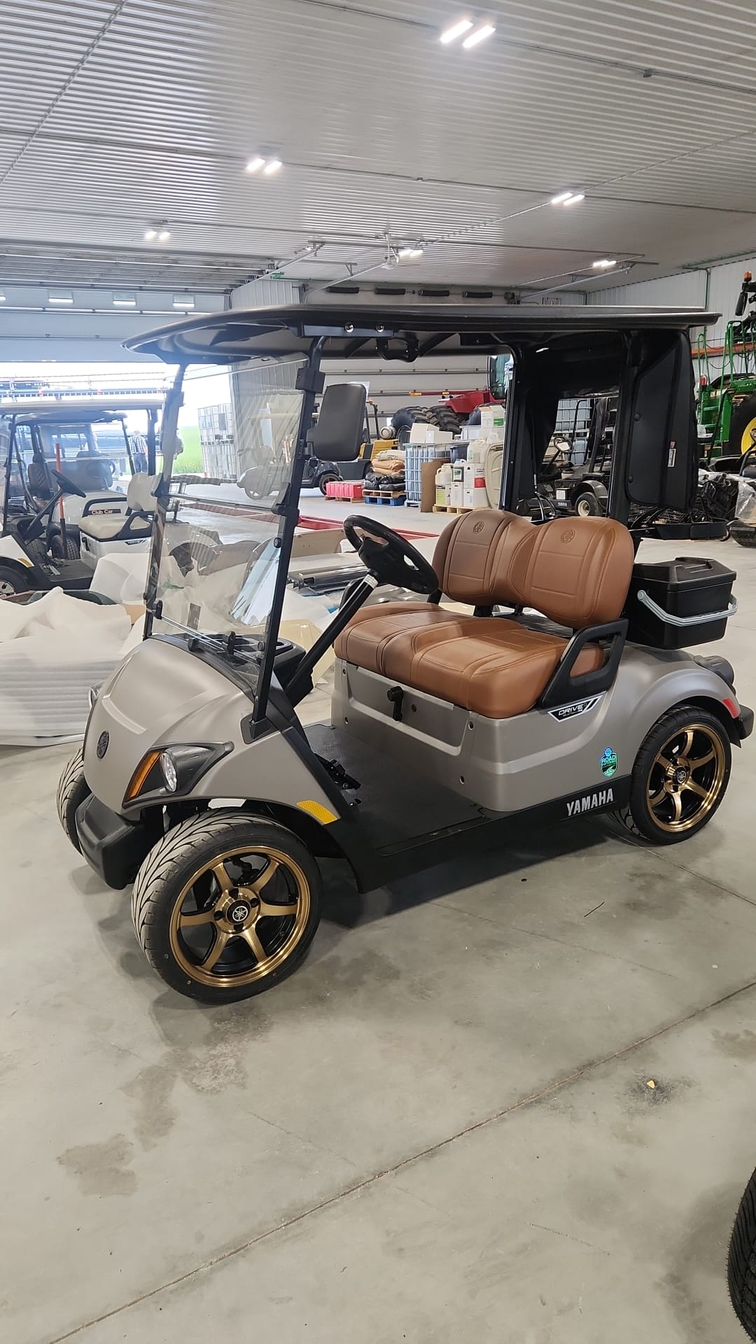 Matte silver Yamaha Drive2 with brown seats and bronze wheels